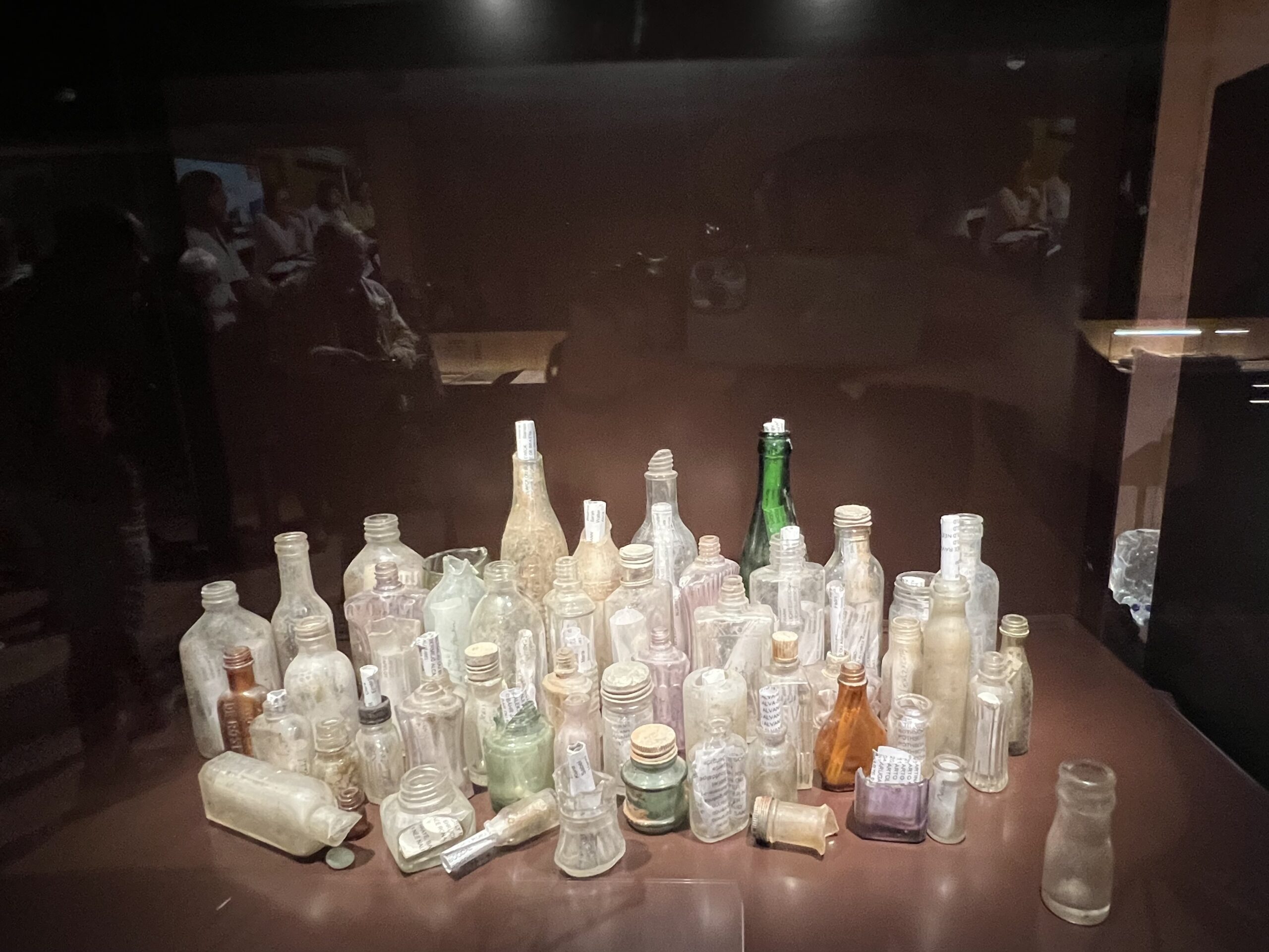 Exhibit number three: a collection of bottles from all periods of its occupation, salvaged from the ruins by artist Nicole Bergé.
